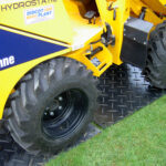 Photo of ground protection mats in use over grass